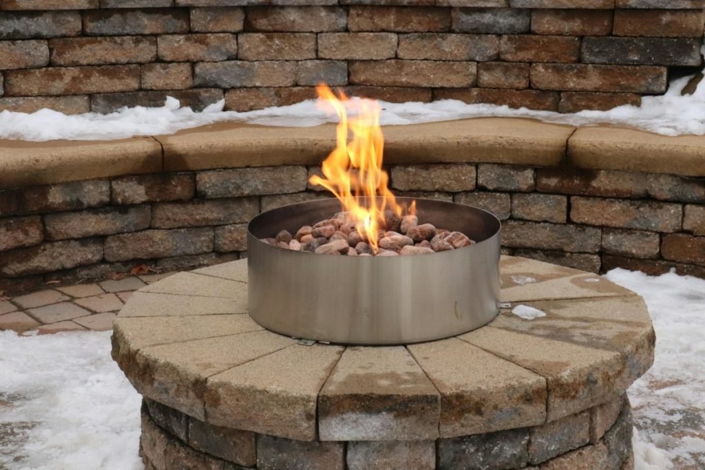Retaining wall with fire pit and seating area. 