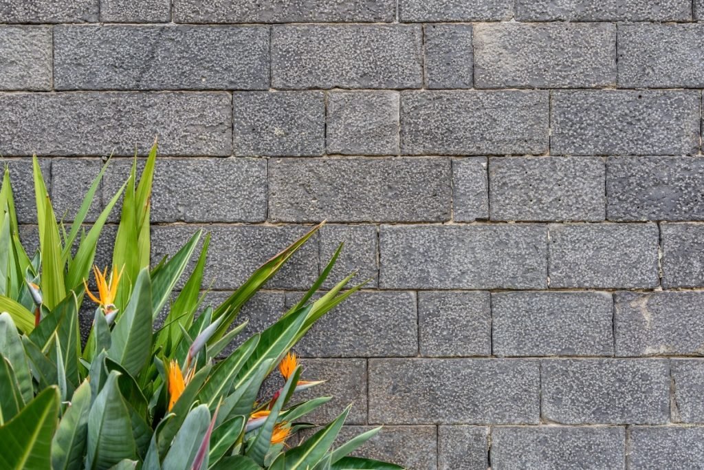 Gray brick retaining wall.