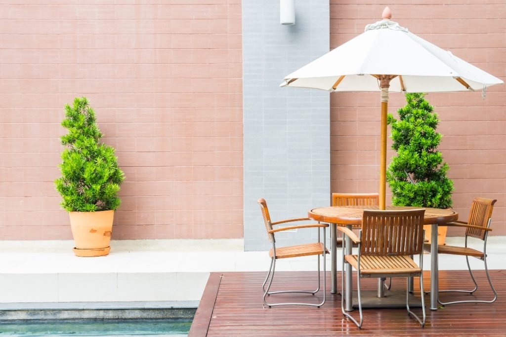 An over-the-pool deck with outdoor furniture.