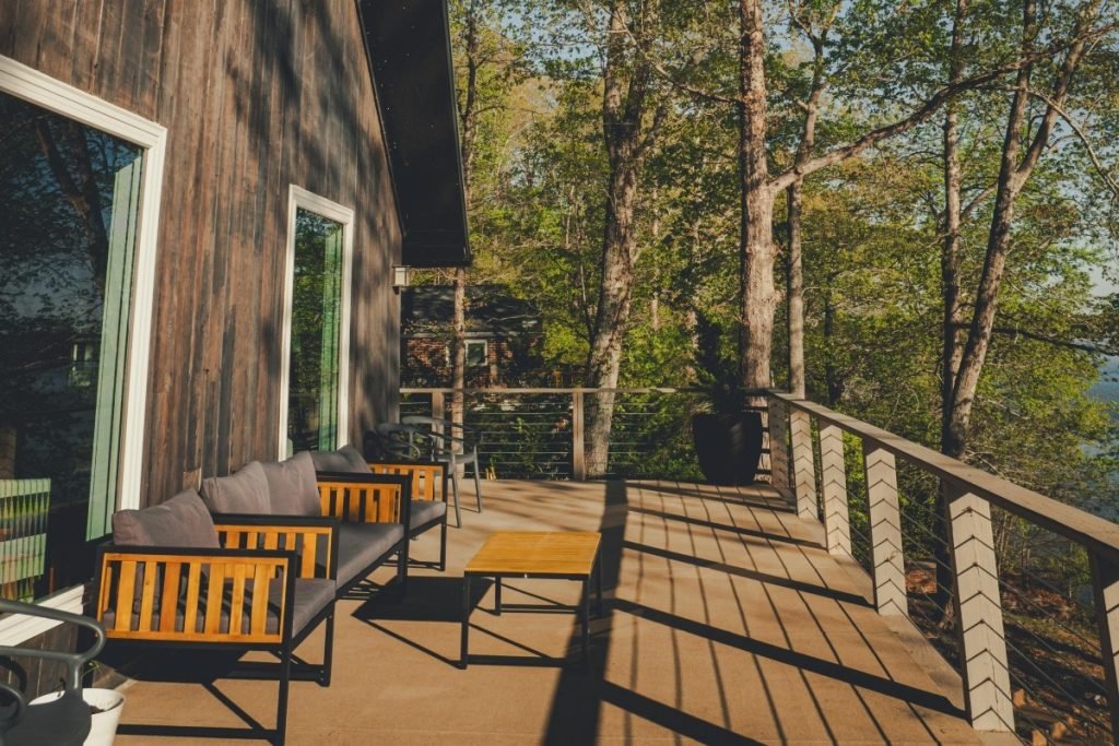 Cabin in the woods with a composite deck.
