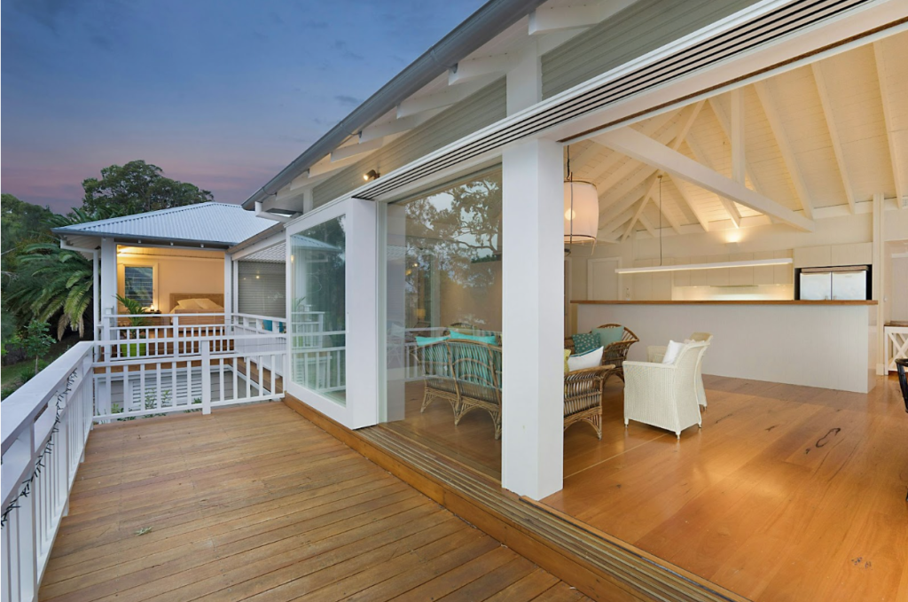 Half-closed deck design with privacy​ and railing.