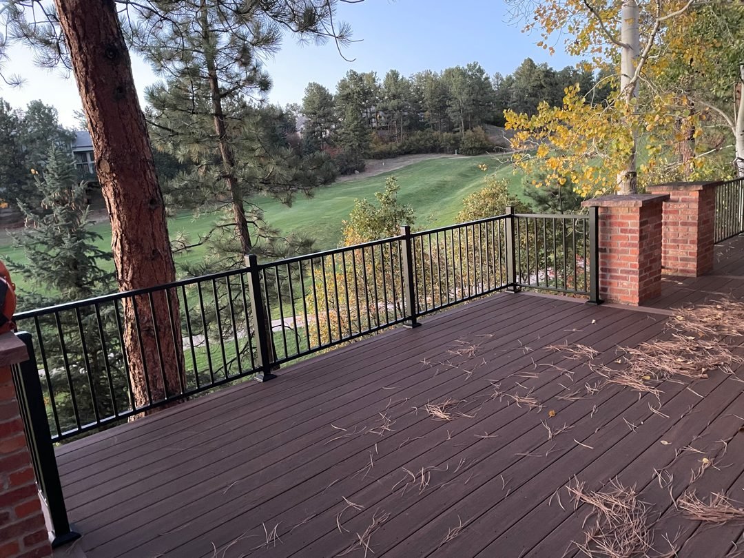 Composite deck with Deckorators black aluminum railing built by Elevate Landscape & Spas in Castle Rock